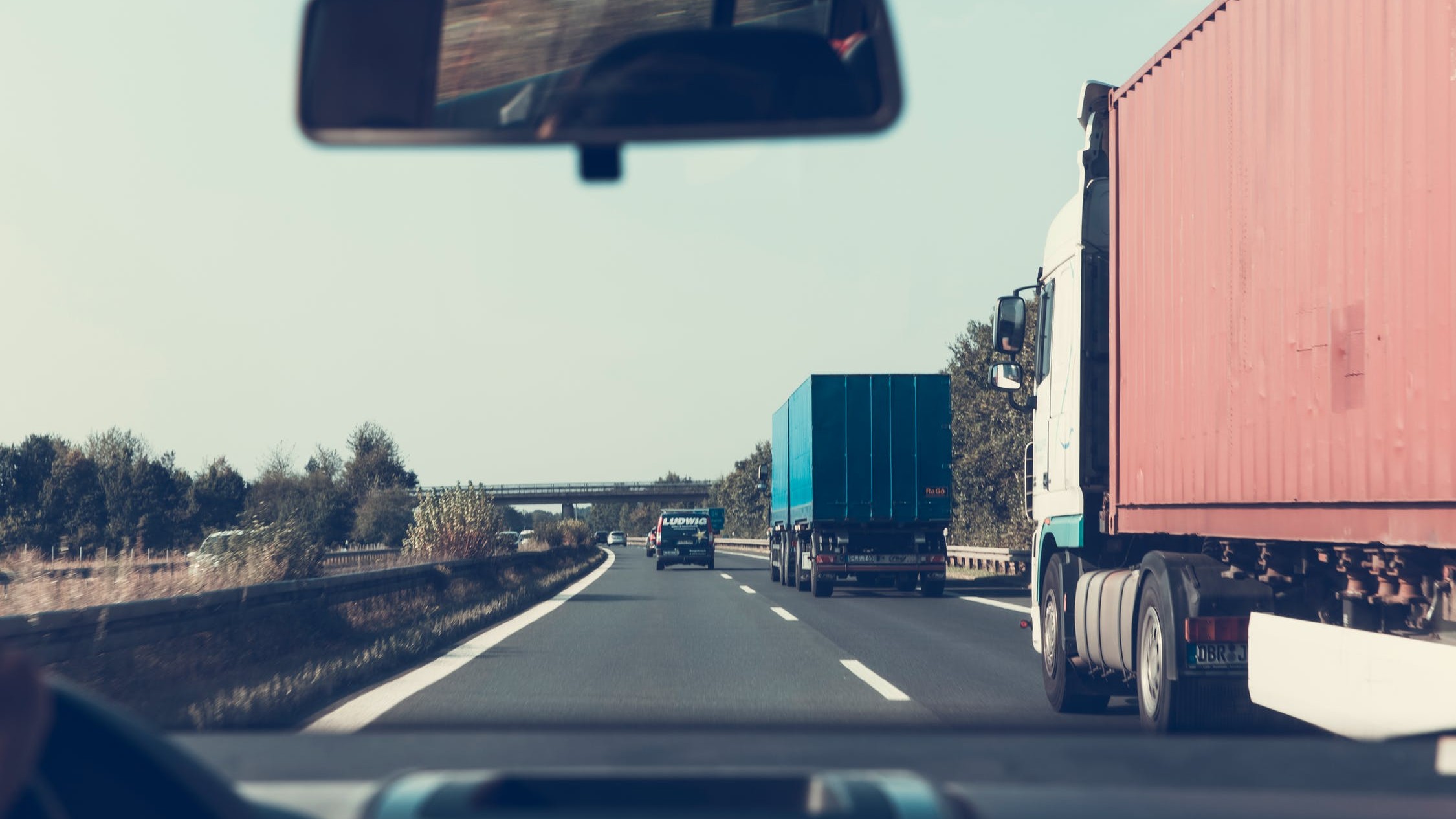 Road with trucks and cars
