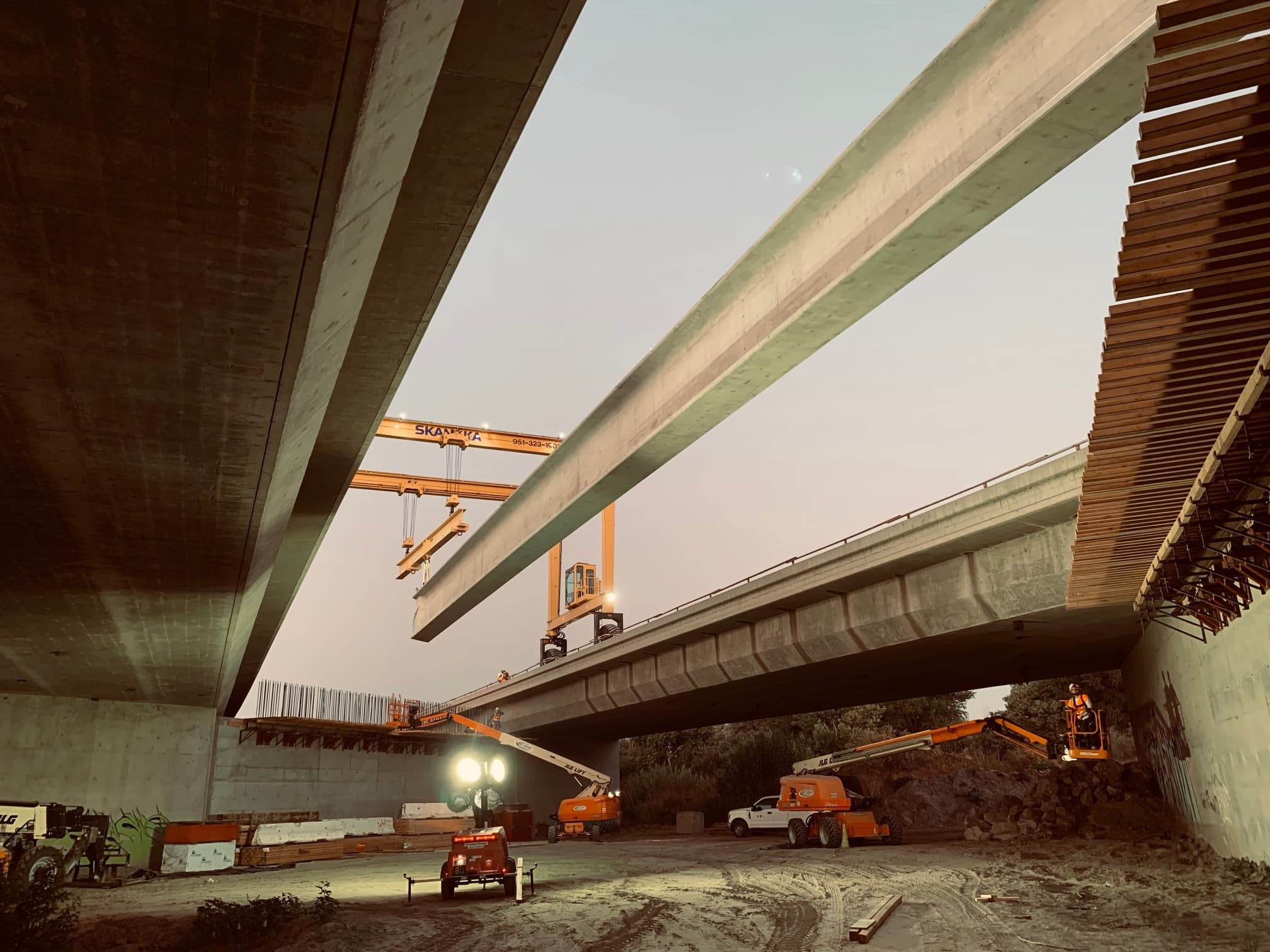 Photo of girder being placed by crews