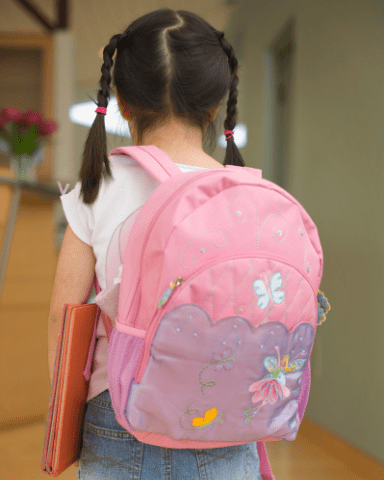 photo of little girl with a pink backpack