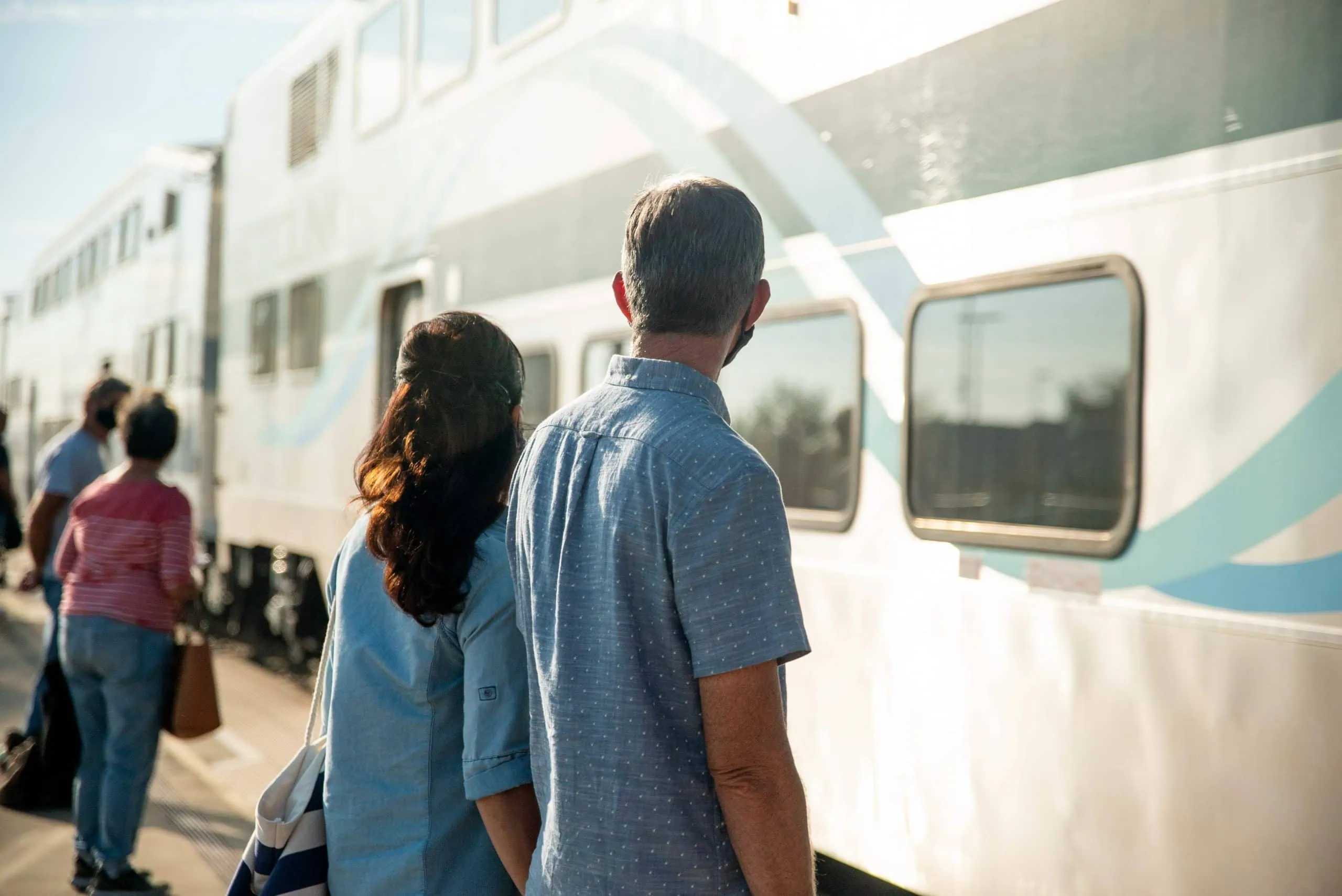 Older couple waiting to board train