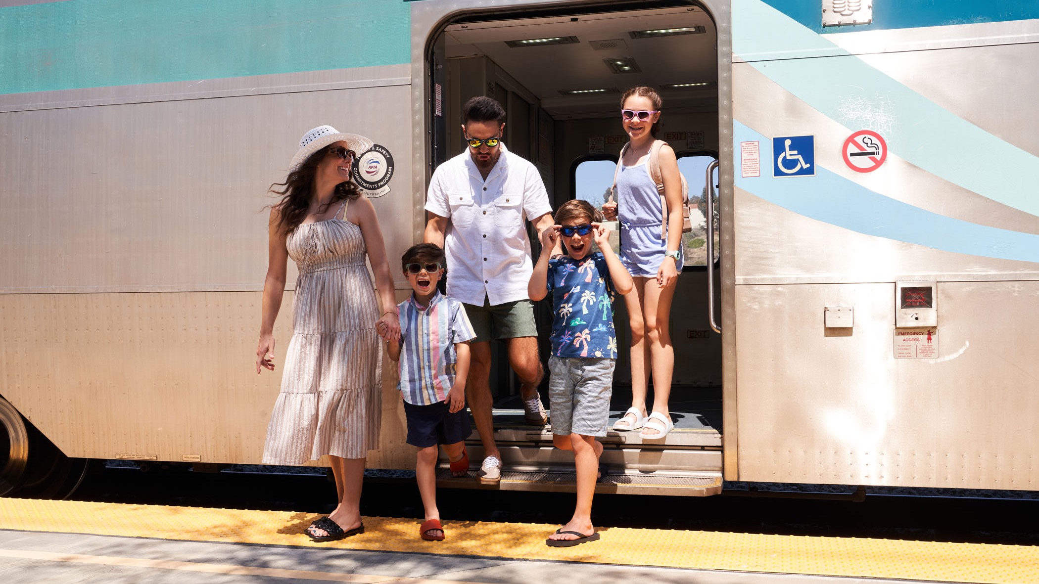 Family riding a Metrolink train