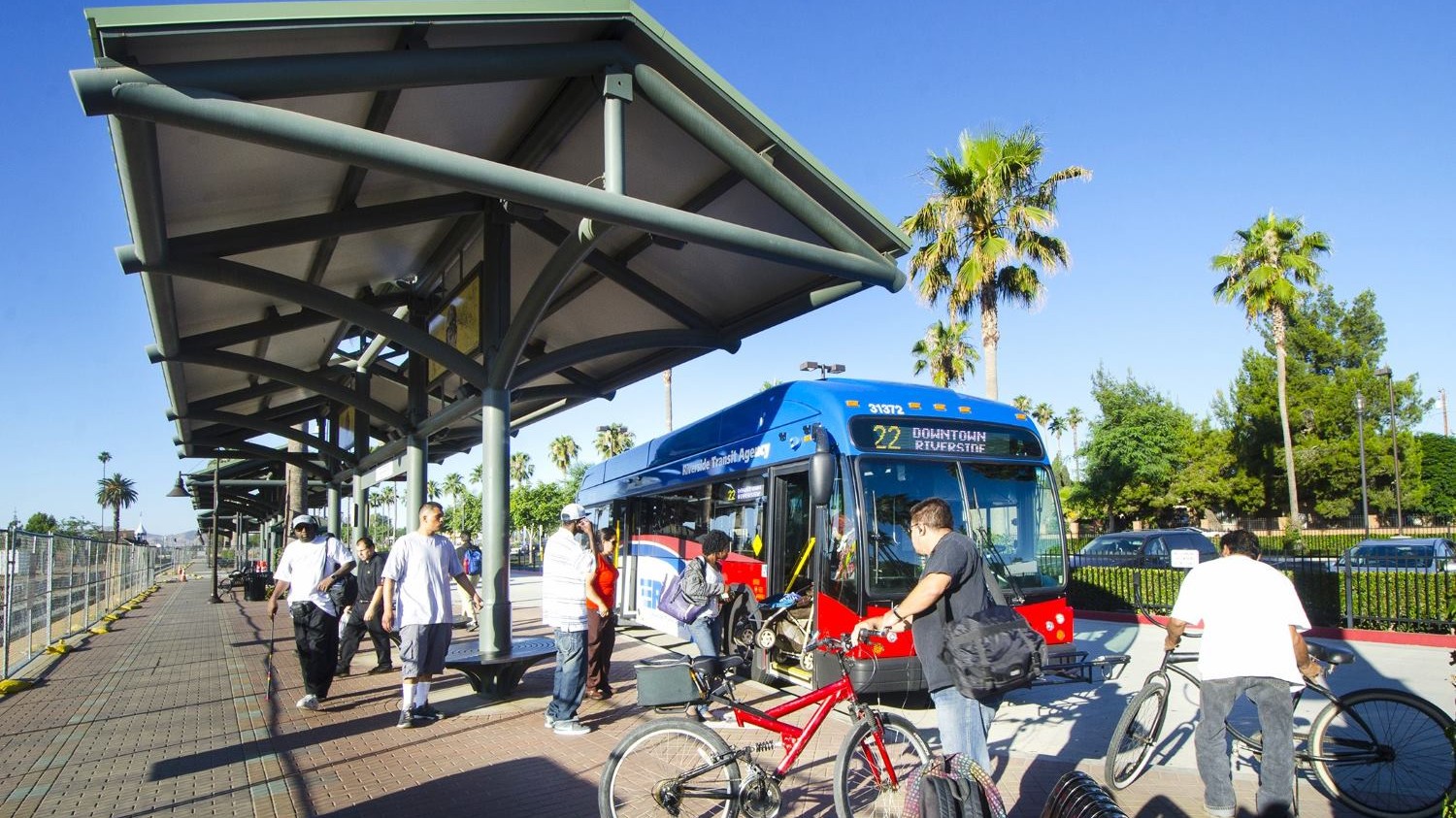 Passengers boarding an RTA bus in Riverside, CA