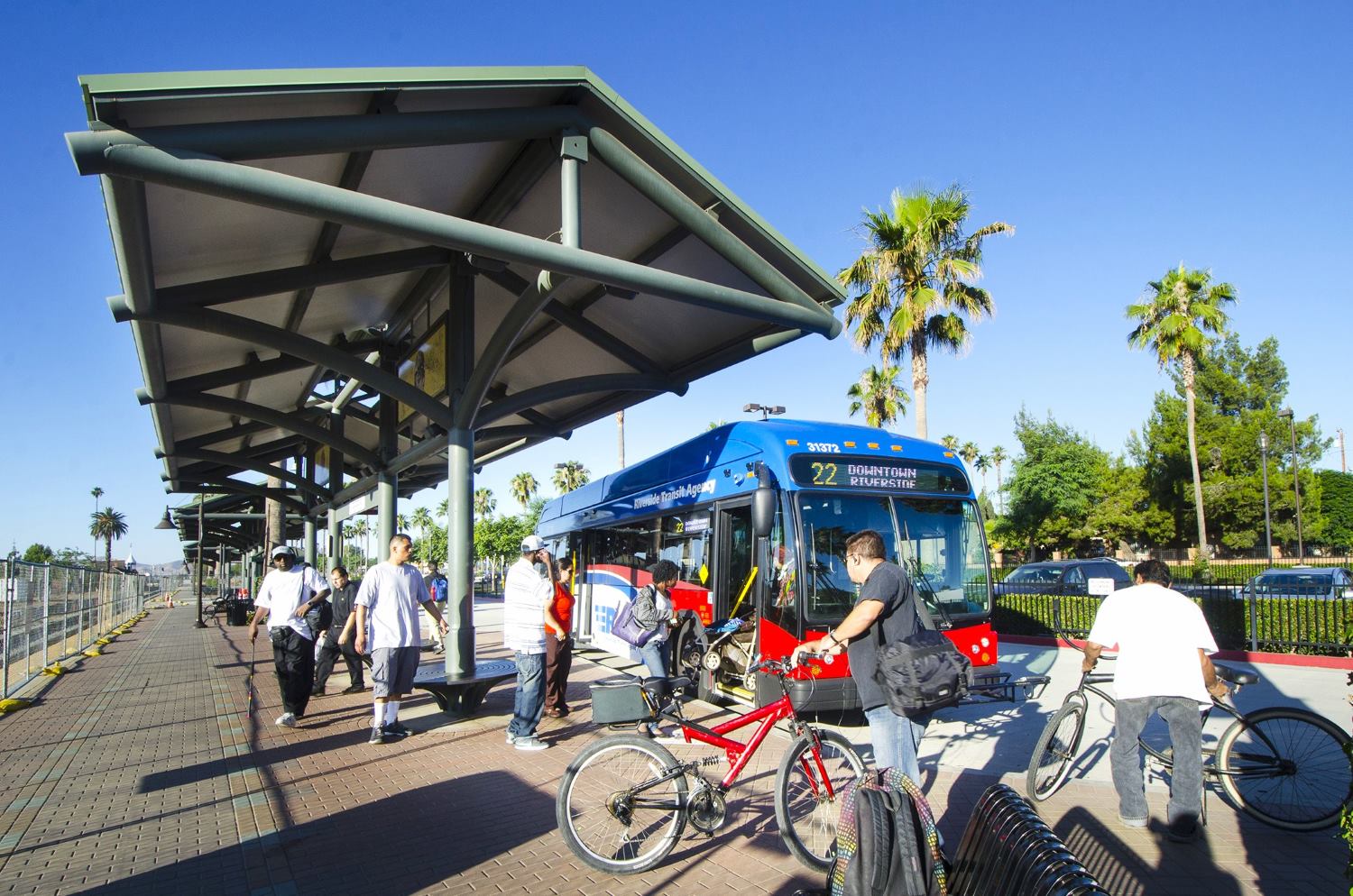 Passengers boarding an RTA bus in Riverside, CA